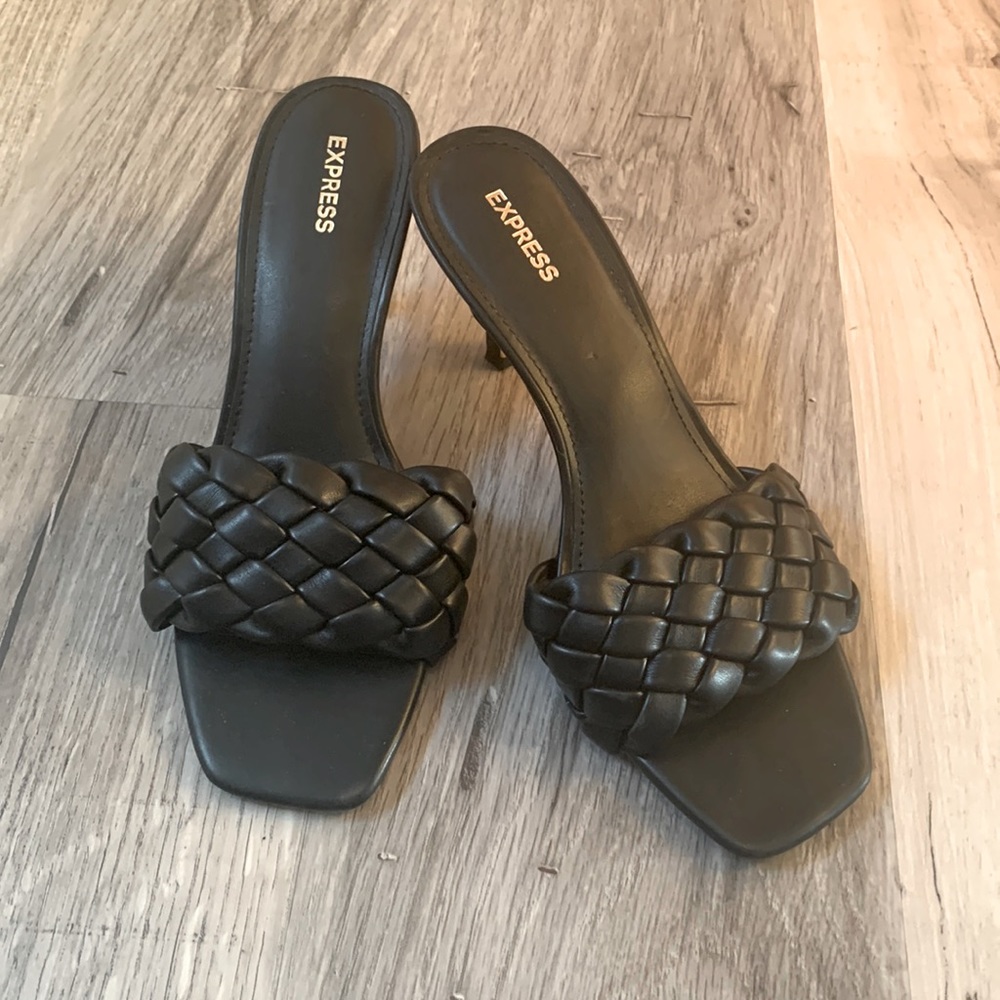Black woven strap heels.